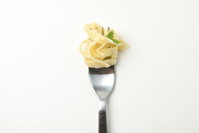 Fork with tasty pasta isolated on blank background