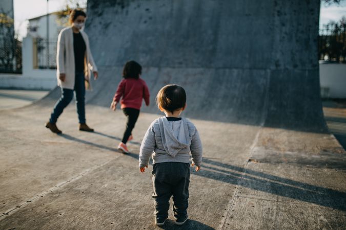 A young family of three in a skate park