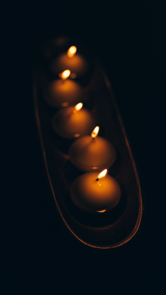 Lit candles on tray
