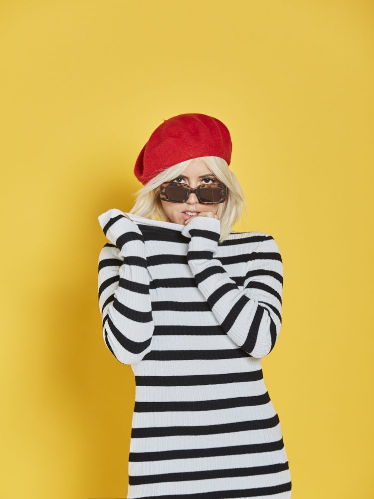 Happy young female in red beret