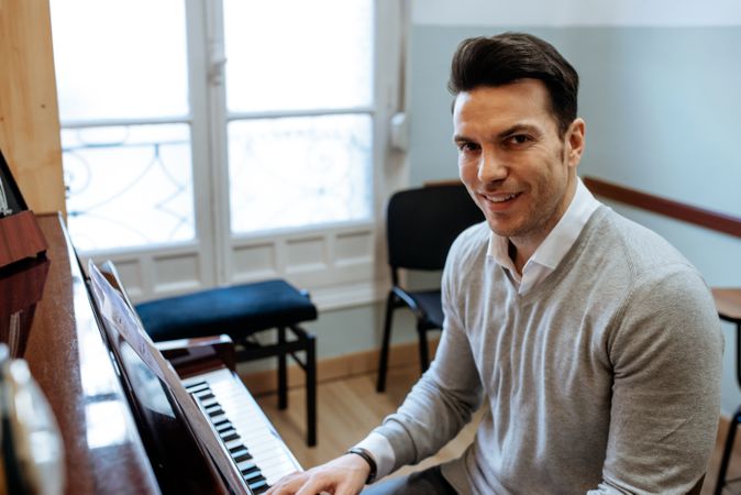 Man playing piano in studio