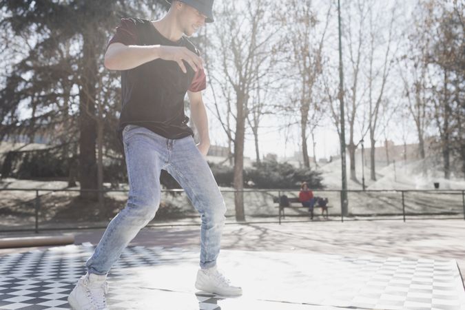 Man dancing break dance in park