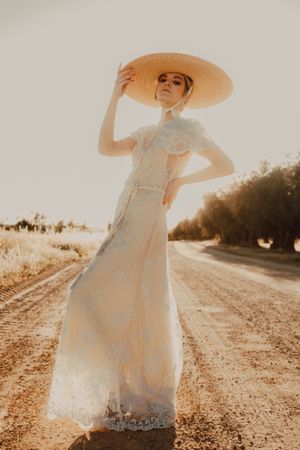 woman in hats in bright sunny day