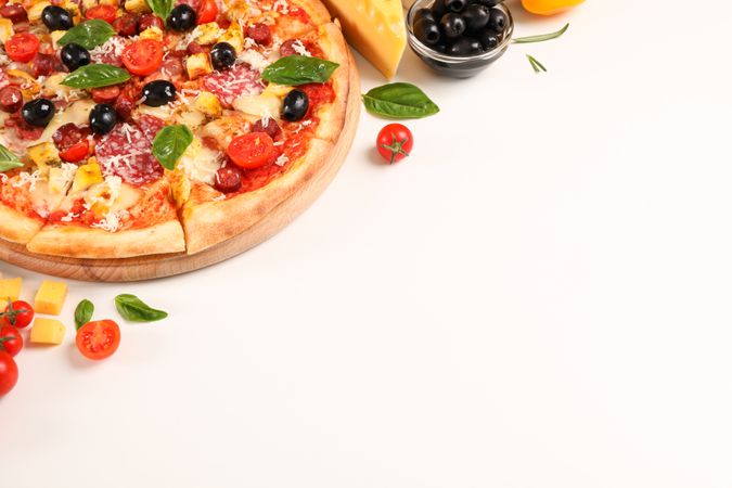 Tasty pizza and ingredients on plain background, space for text