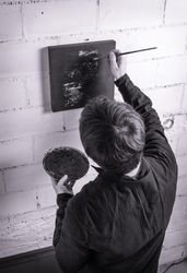 Painter artist working on a oil canvas