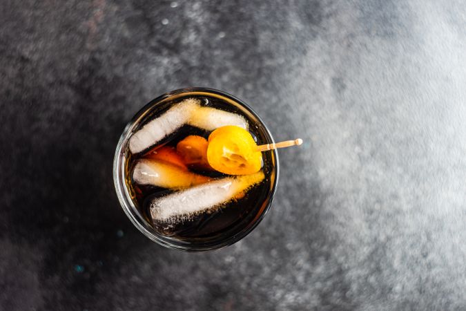 Top view of whisky with cola and ice