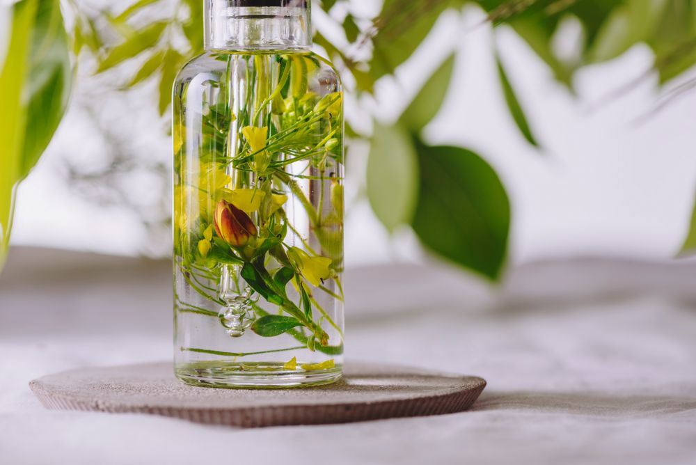 Essential oil, with flowers and natural herbs