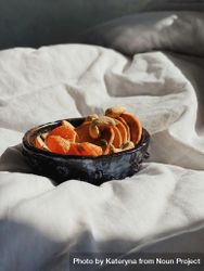 Bowl of orange slices for breakfast in bed 5rXDpb