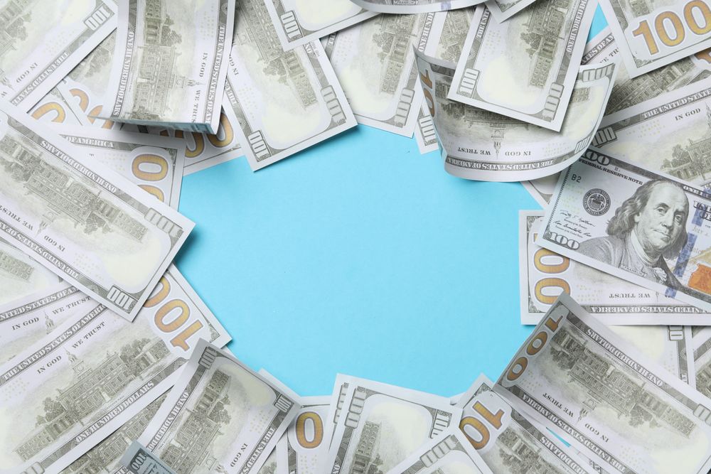 Dollar money on blue background, space for text