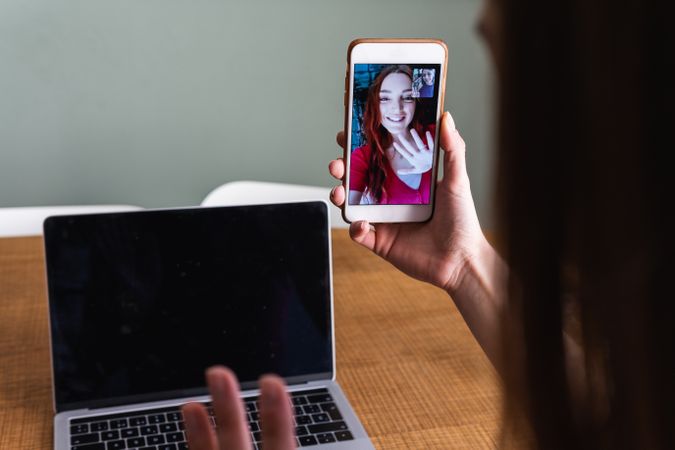 Crop woman having video call via smartphone
