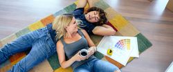 Couple resting lying on the carpet