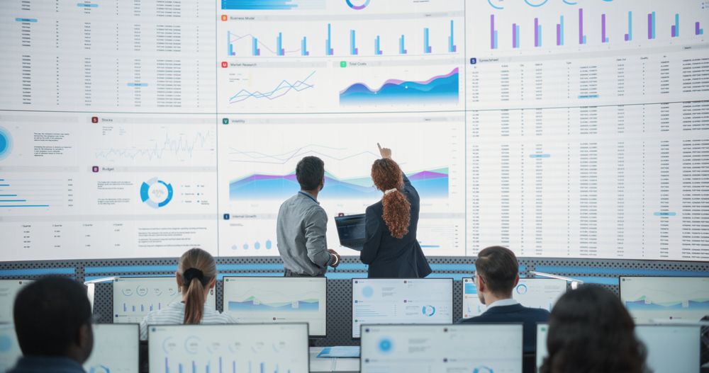 Multiethnic Employees Working On Computers For Successful Venture Capital Company