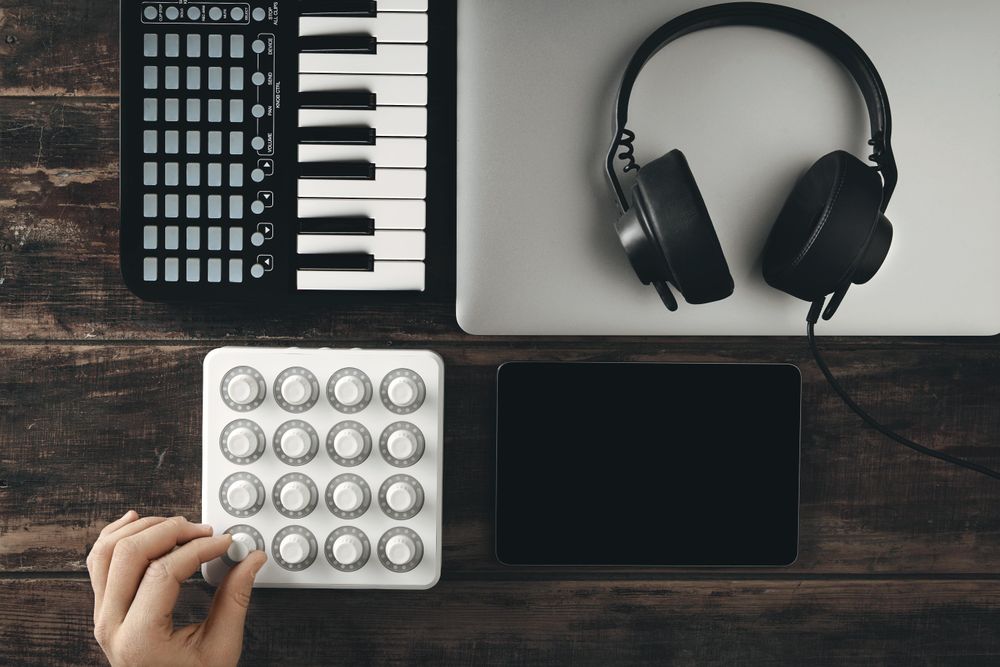 Man with modern at home music production set up