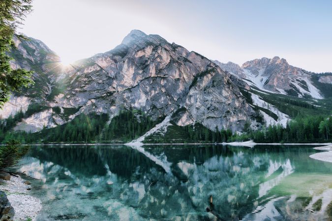 Mountain and tree reflection on lake