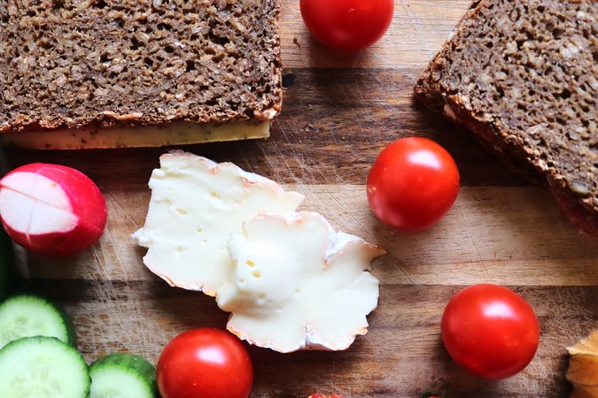 Close view on a healthy german breakfast with sandwiches, tomatoes and cucumbers