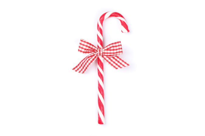 Sweet candy cane with bow isolated on blank background