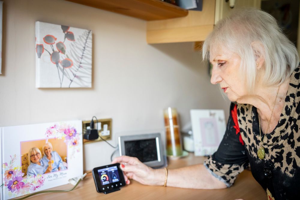 Woman adjusting smart meter