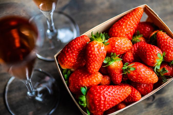 Strawberry basket with flutes of champagne
