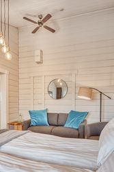 Cozy interior of bedroom with sofa