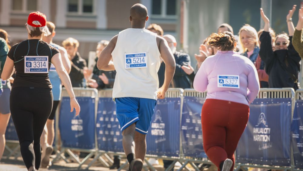 Close Up on the Back of a City Marathon Runners With Signs with Numbers.