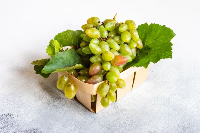 Box of fresh green grapes