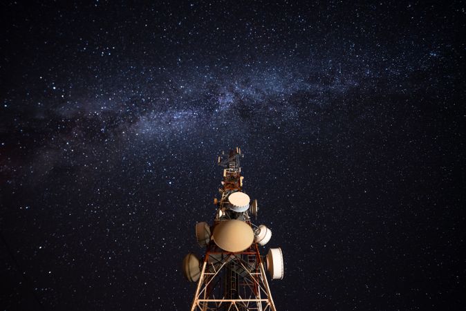 Amazing view of transmission towers against Milky Way in night sky
