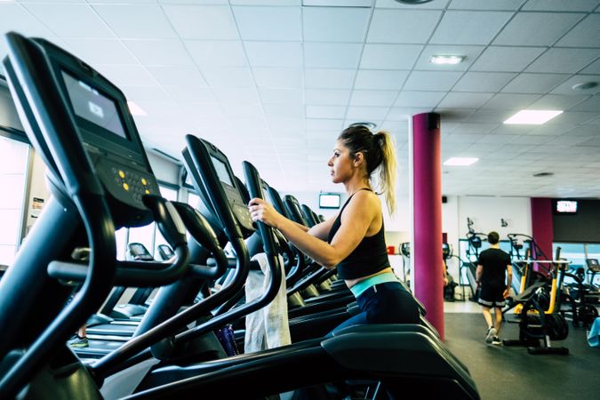 woman on exercise machine