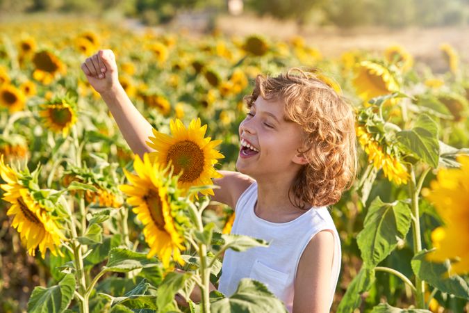 Boy having fun while smelling flowers
