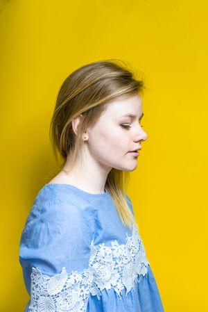 Blonde woman posing in studio