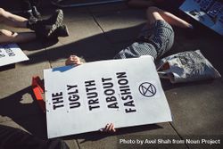 London, England, United Kingdom - September 15th,2019: Protesters lying with body covered with sign bGRXx4