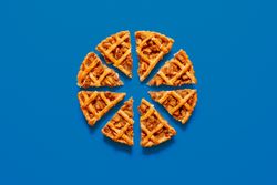 Homemade apple pie minimalist on a blue table