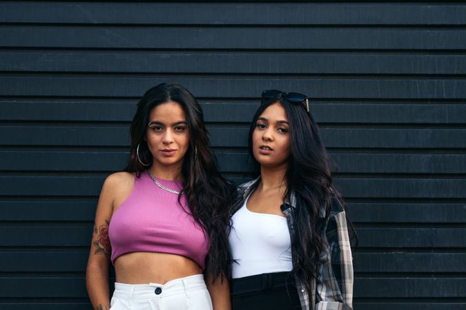 Portrait of two serious latina women