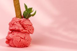 Strawberry ice cream scoops with waffle stick