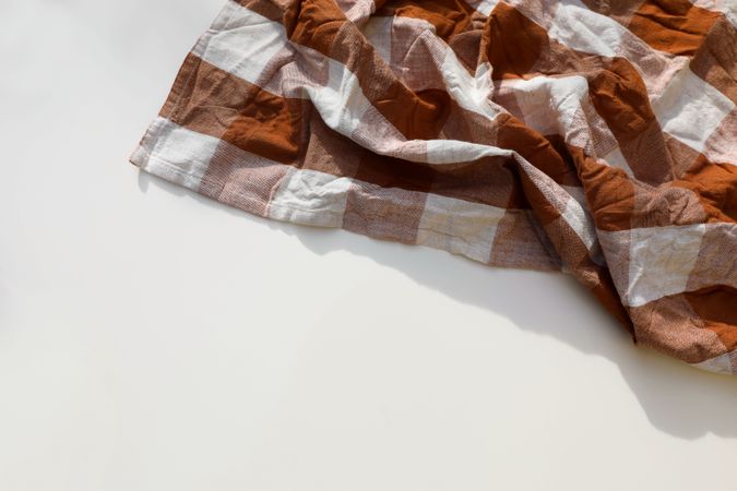 Overhead shot of rusty brown checkered table cloth