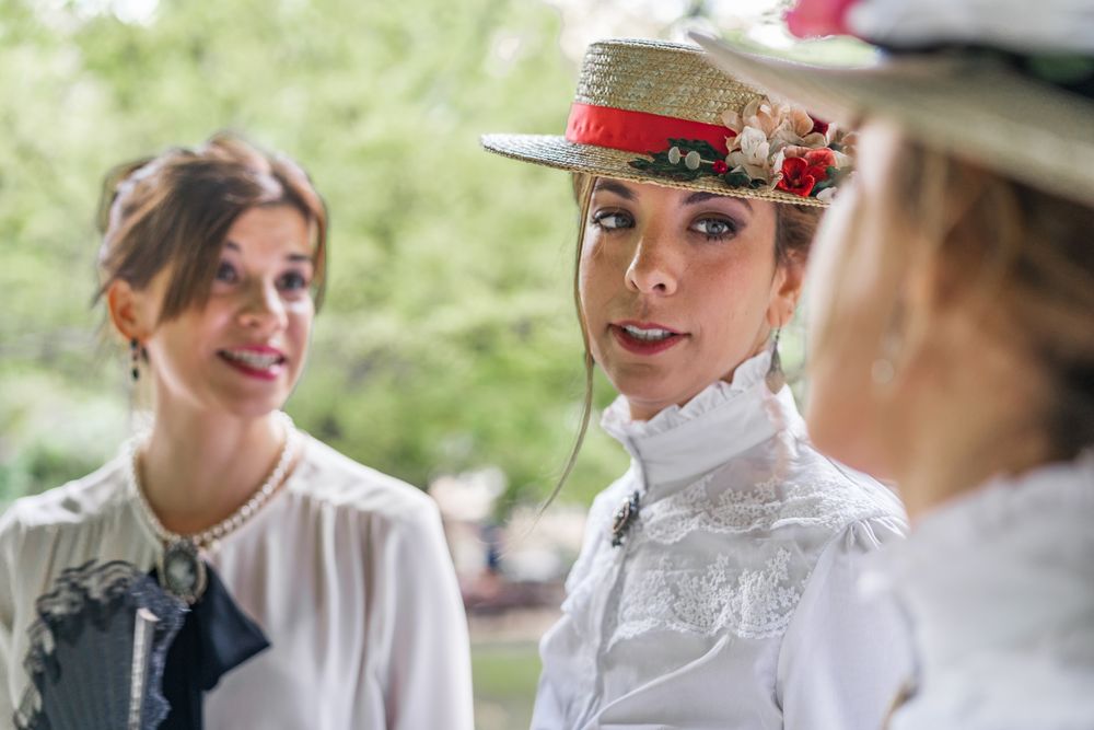 Vintage female friends speaking in garden