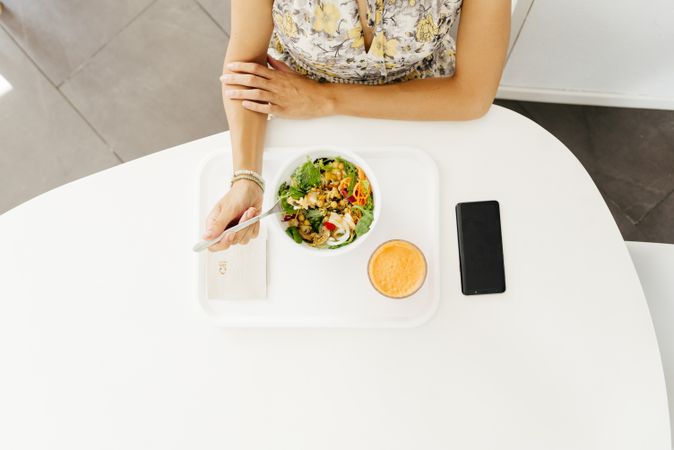 Woman with healthy food sitting in cafe