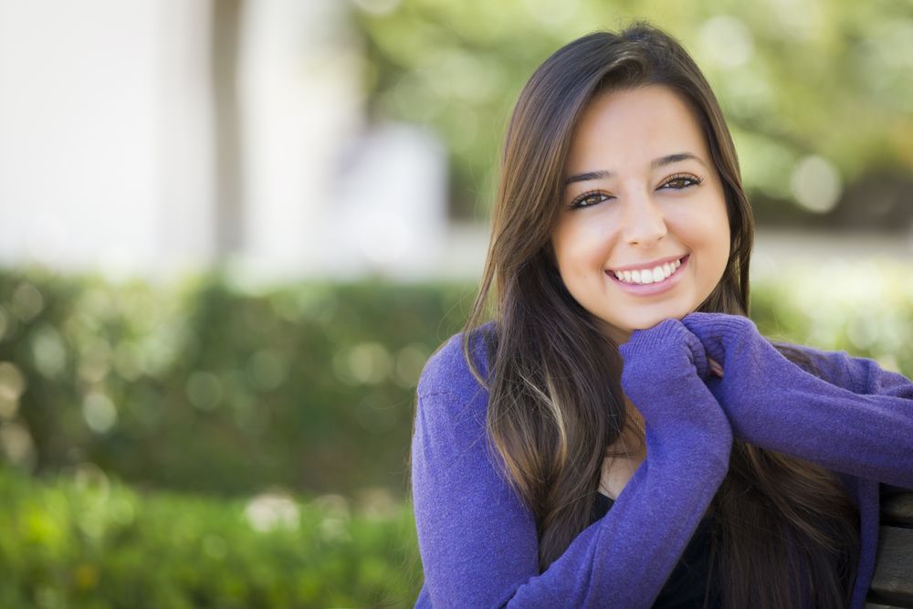 Happy Female Student Portrait on School Campus