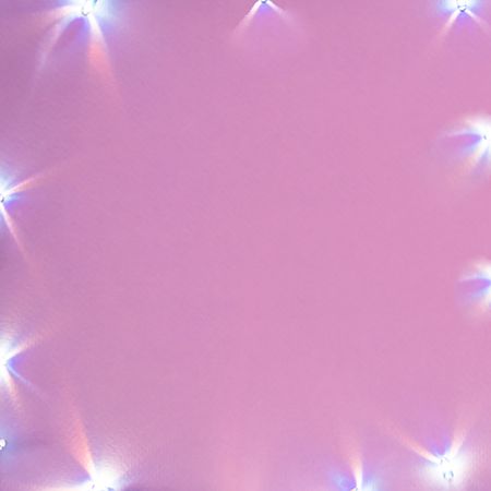 Violet pink background with holiday light as a frame