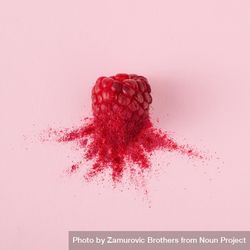 Single raspberry with red dust on pink background 5QgAmb