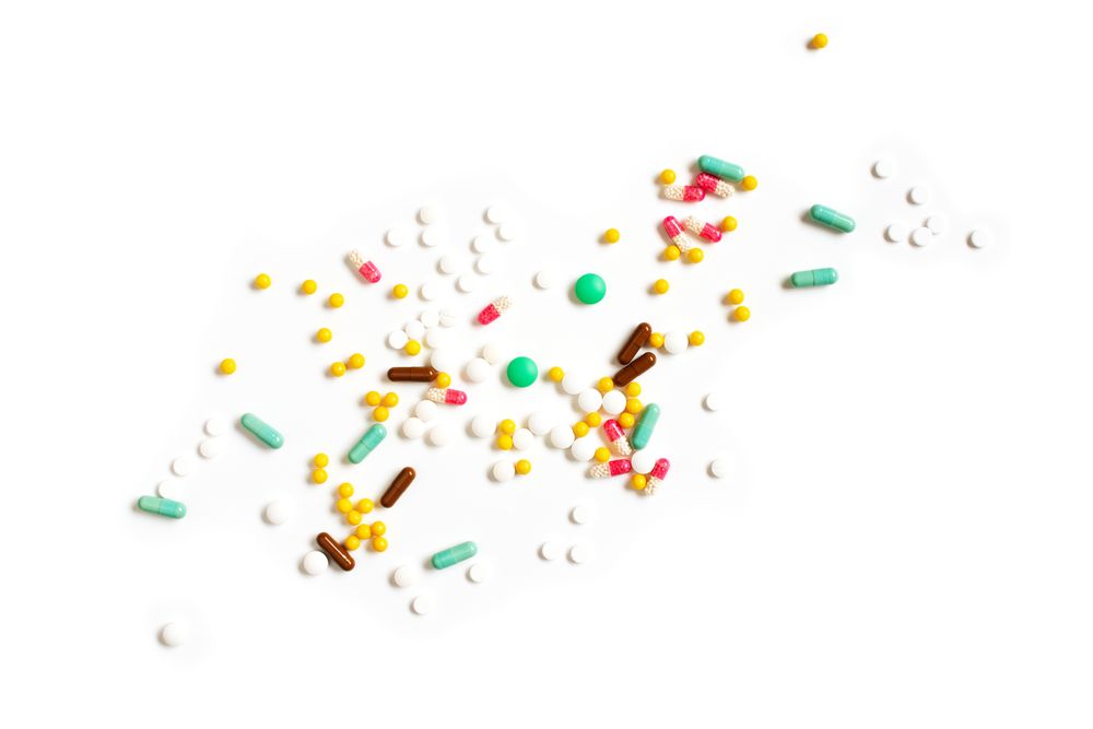 Pills on plain background