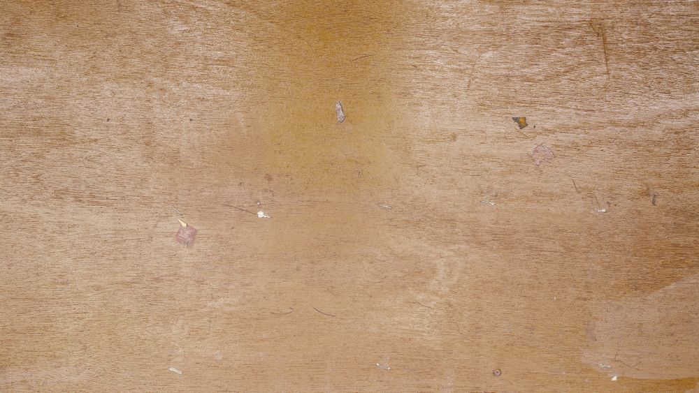 Natural light brown wooden surface with subtle grain and aged texture