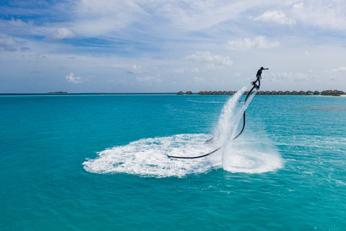 Person jet blading in clear tropical water