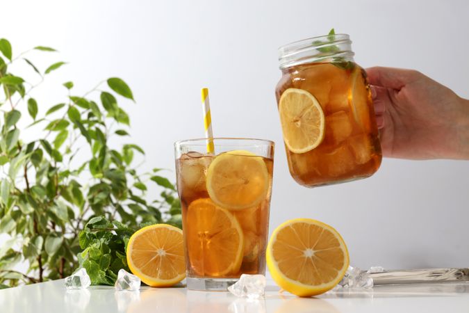 Cold tea with fresh oranges and mint leaves