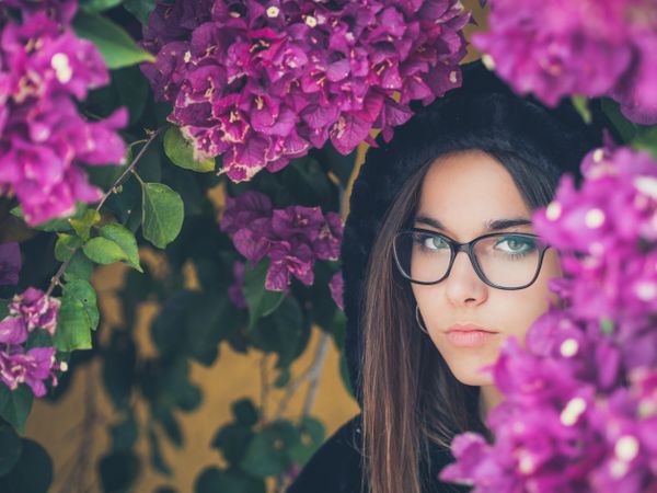 Woman on background of stunning violet flowers
