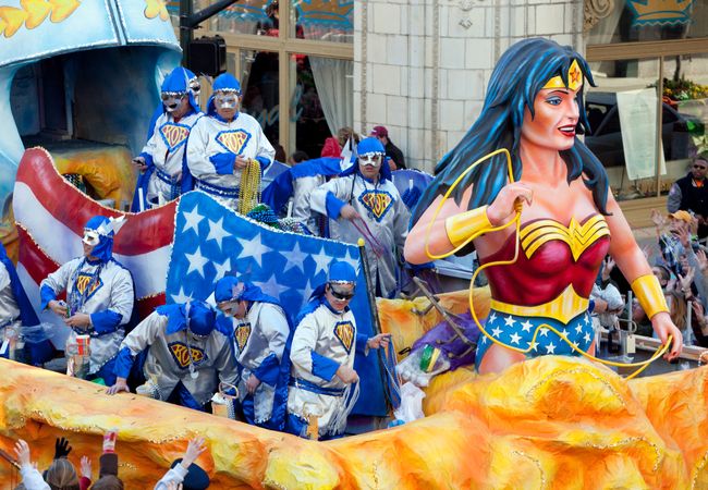 Wonder Woman float in Mardi Gras Parade in Mobile, Alabama with men throwing beads