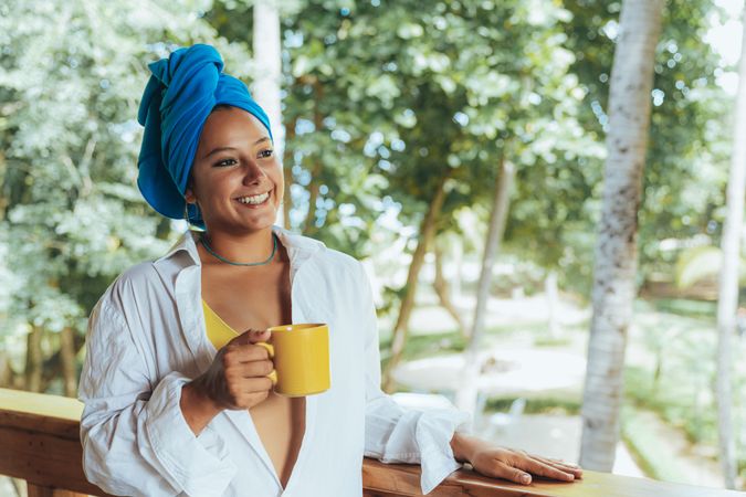 Woman in turban drinking coffee