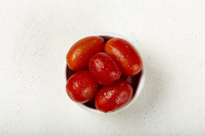 Fresh tomatoes in ramekin