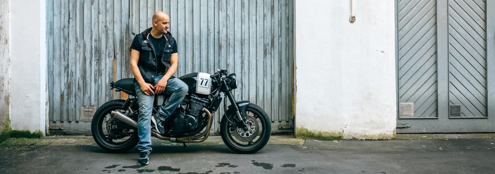 Biker posing with a motorcycle