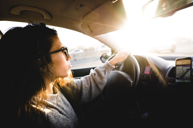 Young woman driving car