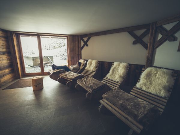 Female relaxing on rocking lounge chair